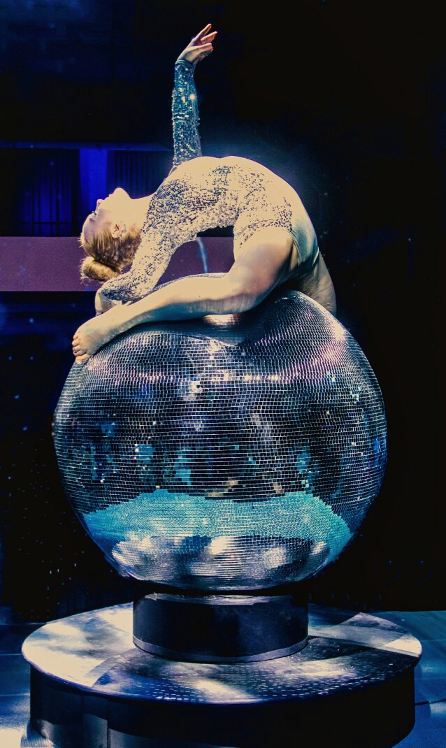 Contortionist on disco ball